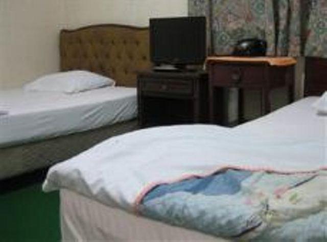 Yoshida Hotel Okinawa Quarto foto